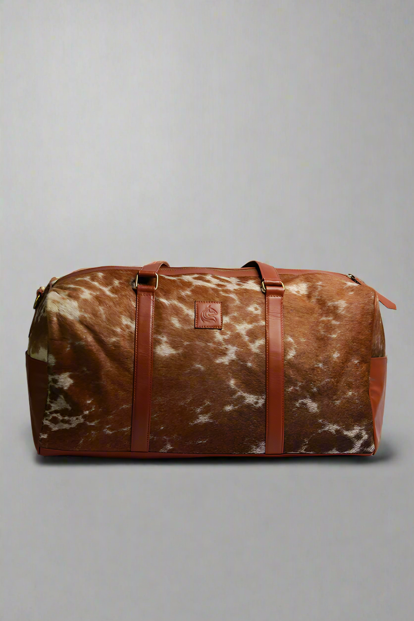 1_5690947e-2eea-4f32-b746-37a4ad345266.png Pinto // Hair-On Duffle Bag - Image 1